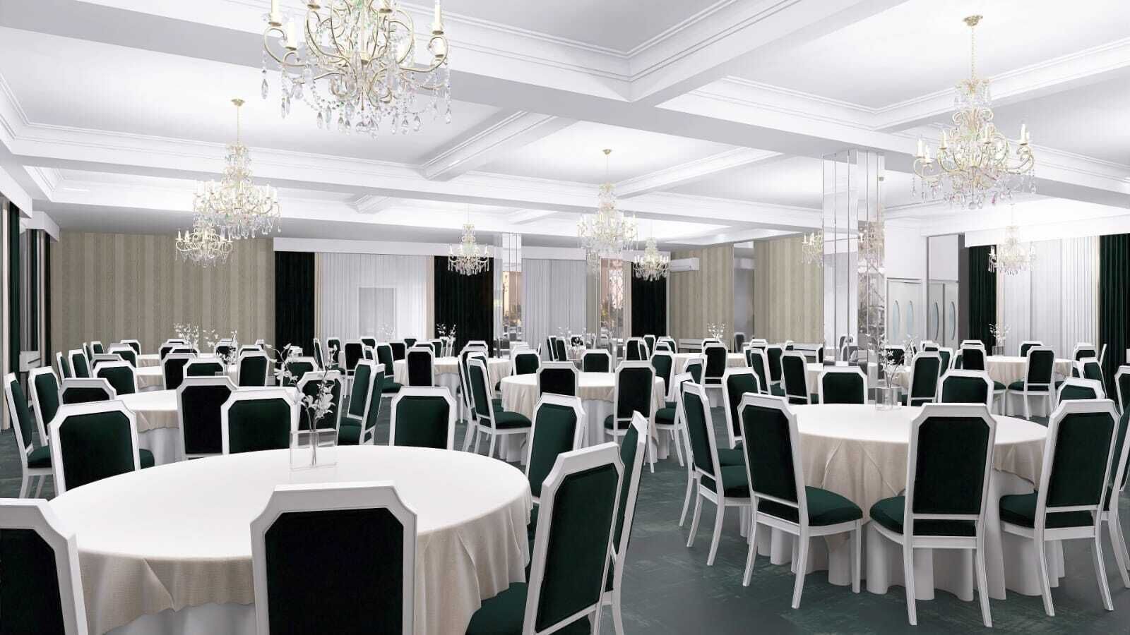 A banquet hall with round tables, green chairs, white tablecloths, and chandeliers.