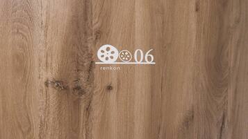 A wooden surface with a logo and text reading "renkon 06".