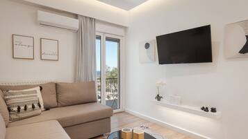 Comfort Apartment | Living area | 43-inch Smart TV with cable channels, Netflix, streaming services