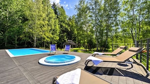 A wooden deck with a swimming pool, lounge chairs, and a small gazebo. - Sun & Snow Ostoja Parku Narodowego (Szklarska Poreba)