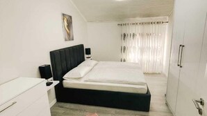Apartamento familiar | 1 dormitorio, cortinas opacas, tabla de planchar con plancha