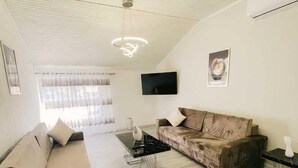 Apartamento familiar | 1 dormitorio, cortinas opacas, tabla de planchar con plancha