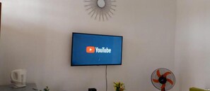 Appartement Deluxe | Coin séjour | Télévision à écran plat