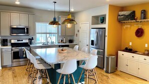 Fridge, microwave, oven, stovetop - Ideal for both professionals and families, the Denver Chile House offers a fully furnished residence featuring four (4) welcoming bedrooms, a dedicated workspace for remote professionals, and a spacious kitchen table for quality family time. (Commerce City)