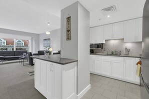 Fridge, microwave, oven, stovetop - 1 Bedroom Furnished Apartment at Penn Quarters (Washington)