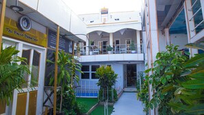 A multi-level building with balconies and a sign for "The Finest Dining Spot". - AFRIKANDO ROYAL CASTLE (Dar es Salaam)