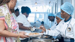 A buffet line with people serving themselves. - AFRIKANDO ROYAL CASTLE (Dar es Salaam)