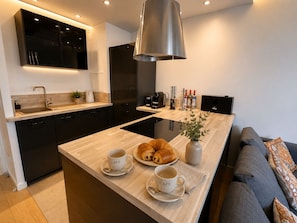 Coffee/tea maker, fridge, microwave, oven