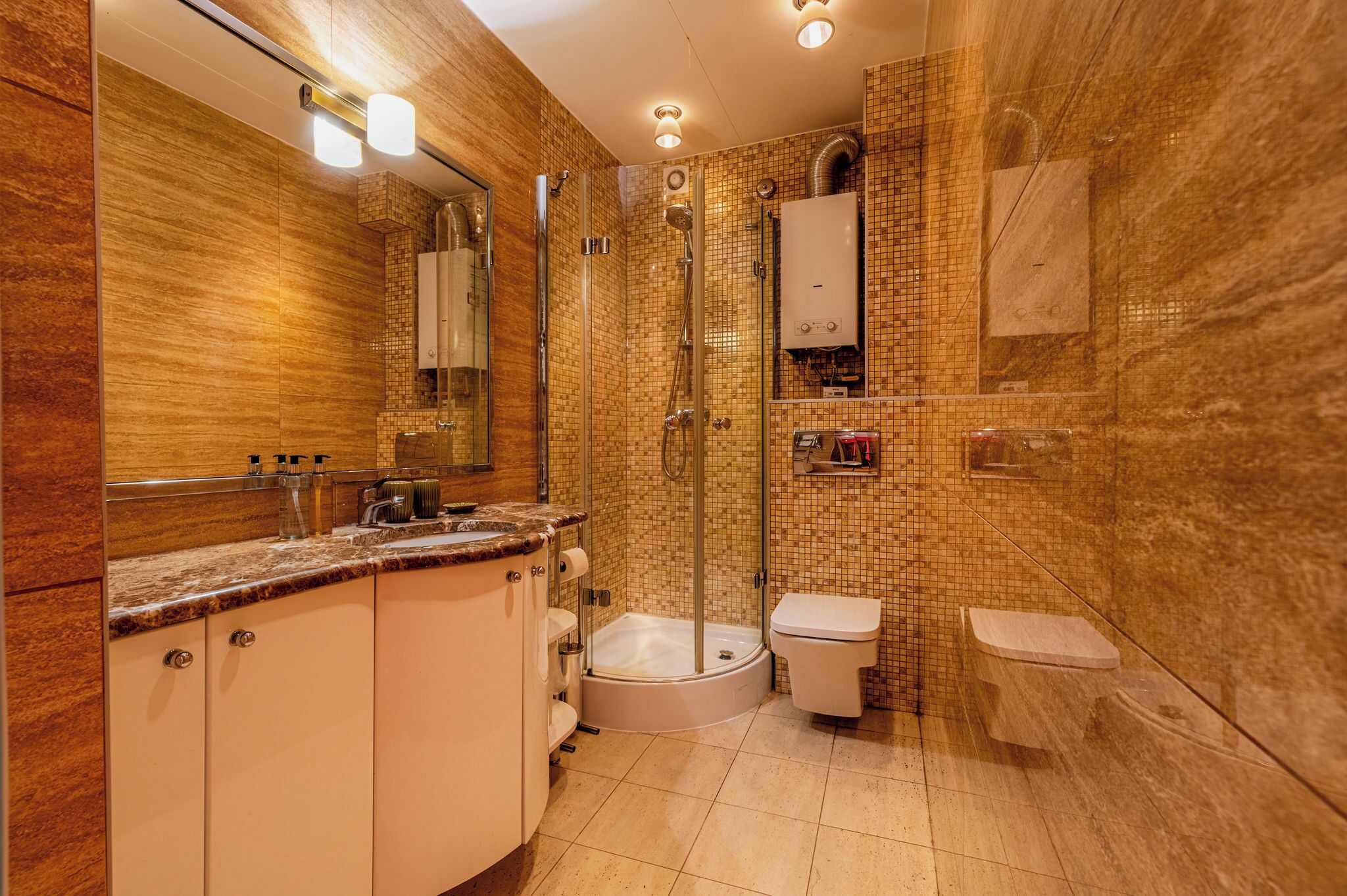 A modern bathroom with a glass-enclosed shower, a bathtub, and a toilet.