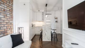City Apartment | Living room | 37-inch flat-screen TV with digital channels