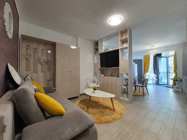 Premium Apartment | Living area | 110-cm flat-screen TV with cable channels