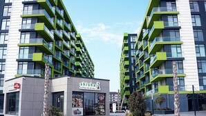 A modern building with a coffee shop named 'Shisha Coffee & Drinks' on the ground floor. - Bianca Residence ALZ (Navodari)