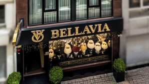A multi-story building with a storefront labeled 'BELLAVIA DELUXE APART' featuring a variety of decorative items. - Bellavia Deluxe Apart (Istanbul)
