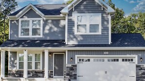 A two-story house with a garage, a front porch, and a small attached garage. - Heated Private Pool, Spacious, Hot Tub All Year (New Buffalo)