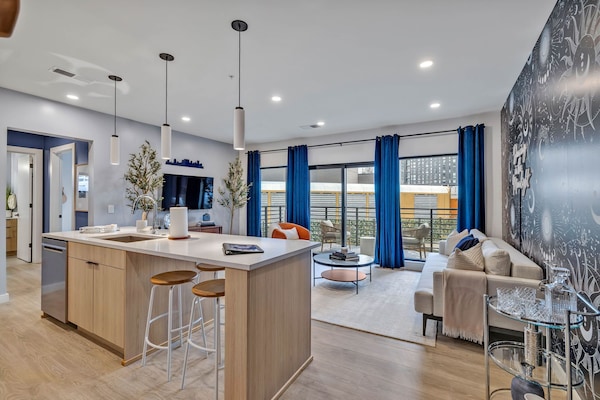 Breakfast bar and living room, looking out to balcony