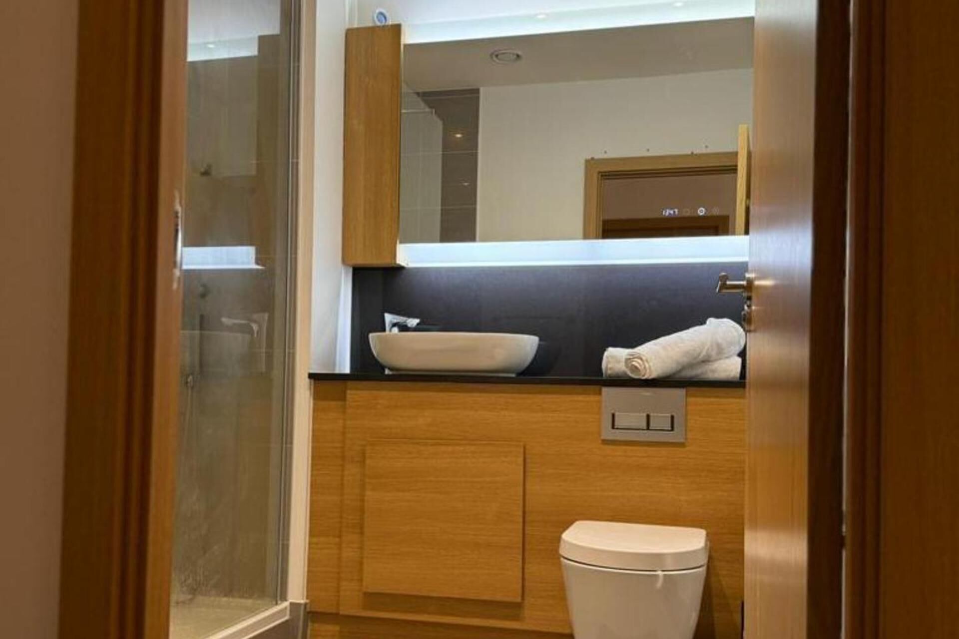 Combined shower/bathtub, deep-soaking bathtub, towels