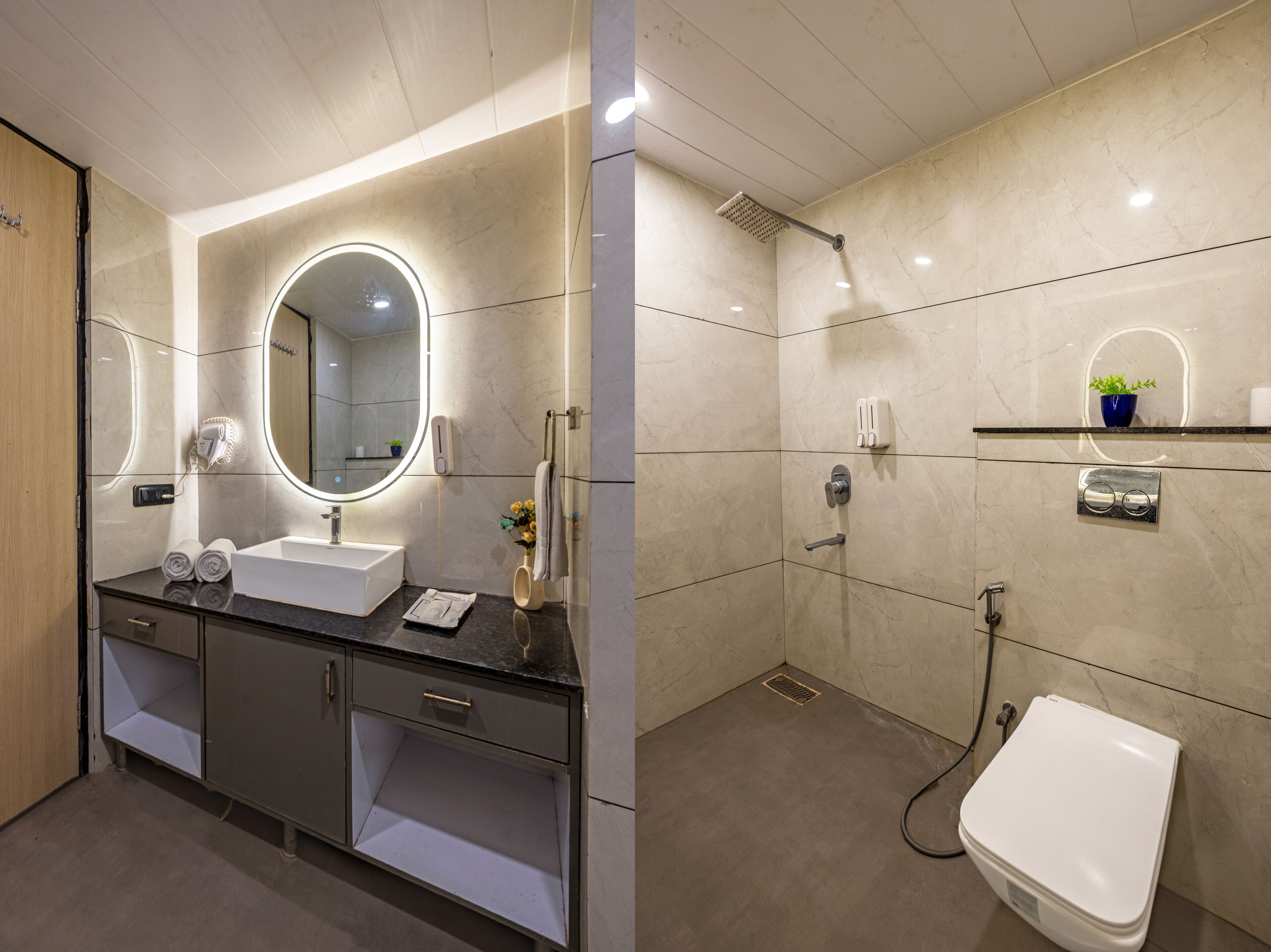 Ein modernes Badezimmer mit Waschtisch, Spiegel, Waschbecken und Dusche.