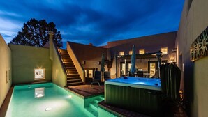 A swimming pool with a hot tub, stairs, and a patio area with outdoor furniture. - Experience luxury at Sedona Red Mountain Retreat, a spacious 3-bedroom house with stunning views. (Sedona)