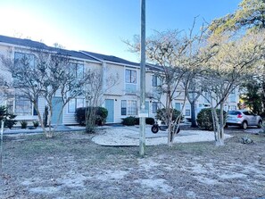 A residential area with houses, a driveway, and a street. - Beautiful and Tranquil Cherry Grove Beach (North Myrtle Beach)