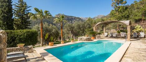 Seasonal outdoor pool, open 8:00 AM to 8:00 PM, pool umbrellas