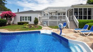 A backyard with a swimming pool, a covered patio, and a house. - Tranquil Arrington Cottage ~ 7 Mi to Franklin! (Arrington)