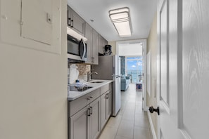 Family Condo, 1 Bedroom, Ocean View, Oceanfront | Private kitchen | Fridge, microwave, oven, stovetop