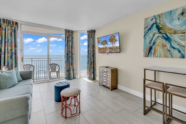 Family Condo, 1 Bedroom, Ocean View, Oceanfront | Living room | 65-inch Smart TV with cable channels
