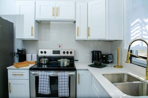 Fridge, microwave, oven, stovetop - The Residence @Seville|Gated|FullyAC|Washer|Dryer (Spanish Town)