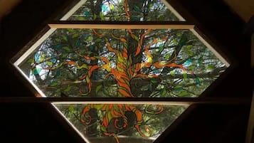 A stained glass window with a tree design.