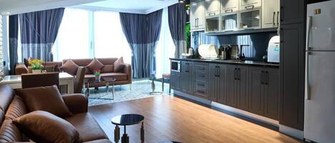 Penthouse | Living area | 30-inch LCD TV with cable channels, heated floors