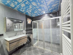 Penthouse | Bathroom | Shower, designer toiletries, hair dryer, slippers