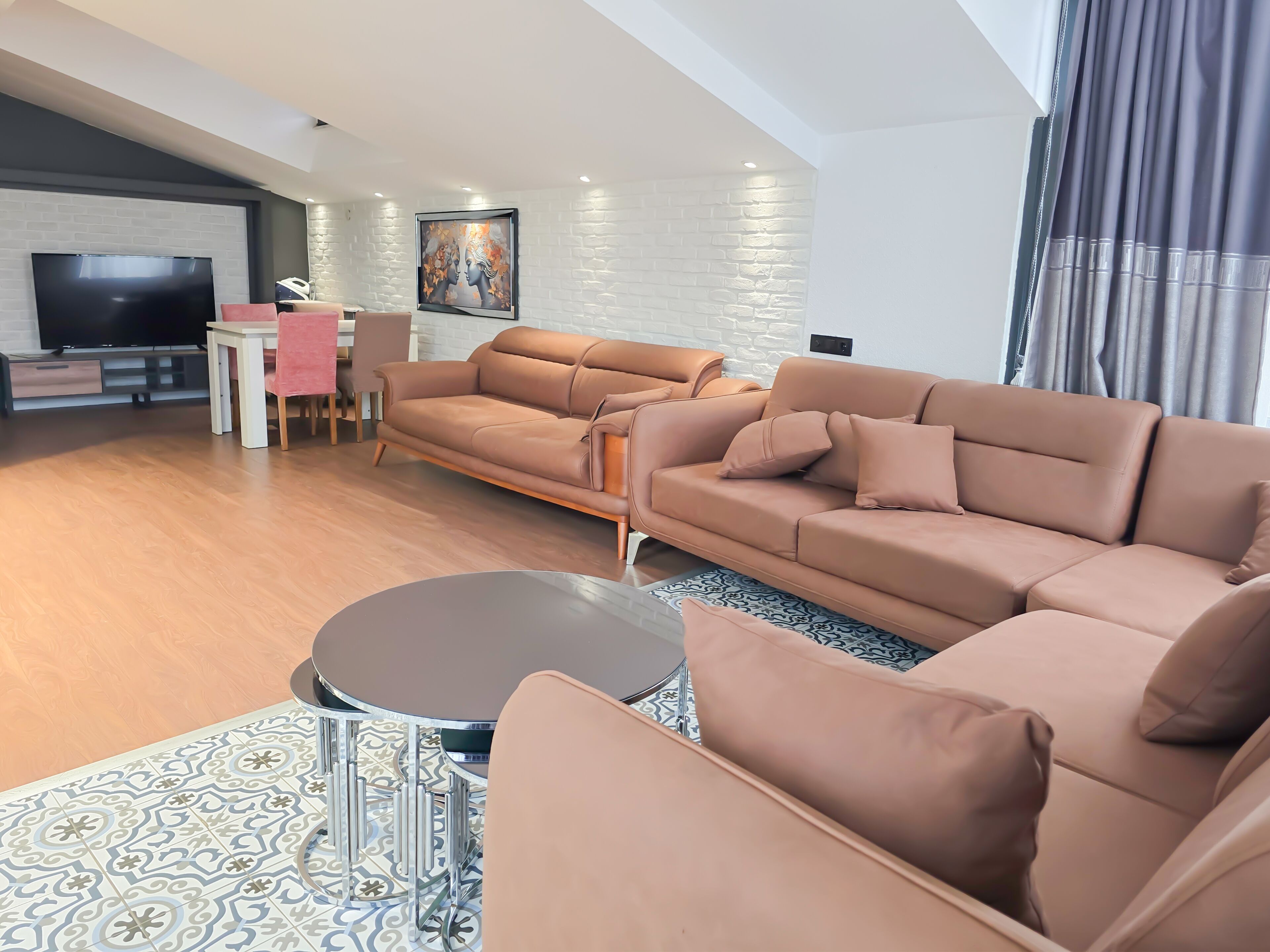 Penthouse | Living area | 30-inch LCD TV with cable channels