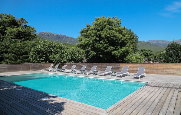 Outdoor pool, open 9:00 AM to 8:30 PM, pool umbrellas, pool loungers