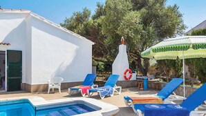 A pool area with lounge chairs, a small building, and a lifebuoy. - Villa Bini Beatriz - Two Bedroom Villa, Sleeps 4 (Binibeca)