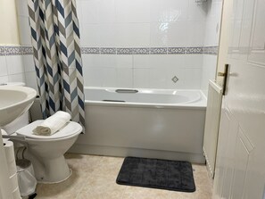 Apartment | Bathroom | Combined shower/tub, deep soaking tub, hair dryer, towels