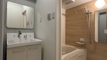 Family Apartment, 1 Bedroom (501) | Bathroom | Separate tub and shower, hair dryer, bidet, towels