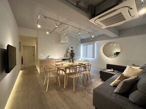 Deluxe Apartment, 2 Bedrooms (502) | Living area | 50-inch Smart TV with digital channels - Art BLDG (Hiroshima)