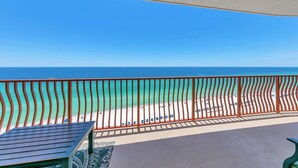 A balcony with a view of a beach and the ocean. - Hidden Dunes 1704 (Panama City Beach)
