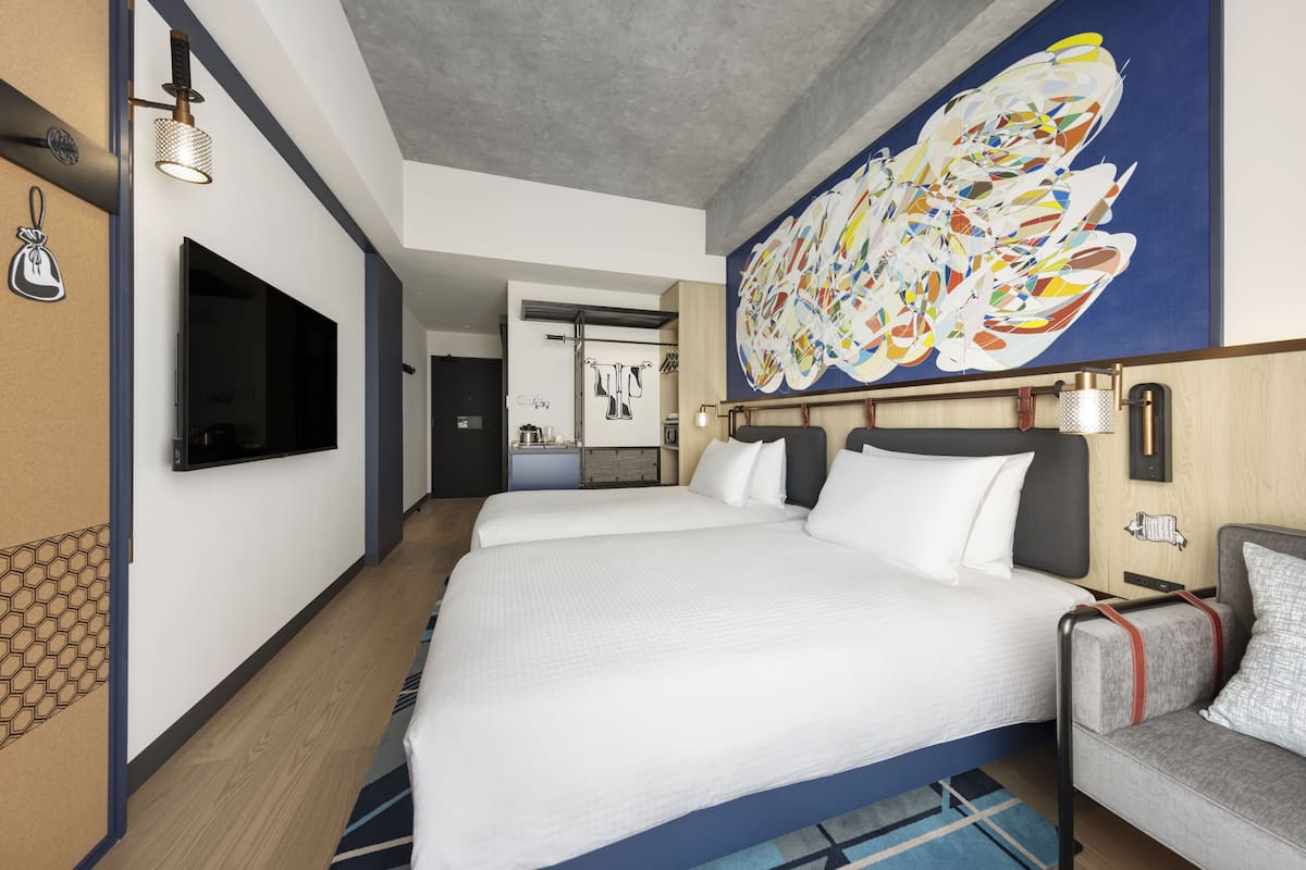Copriletto in piuma, minibar con snack e bevande gratuite