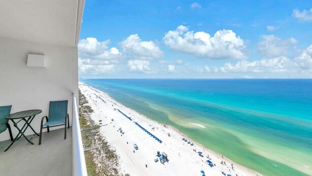 A balcony with a view of a beach and ocean. - Majestic Beach Towers 2-1803 (Panama City Beach)