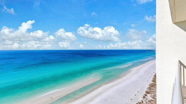 A beach with clear turquoise waters and a white sandy shore. - Majestic Beach Towers 1-2109 (Panama City Beach)