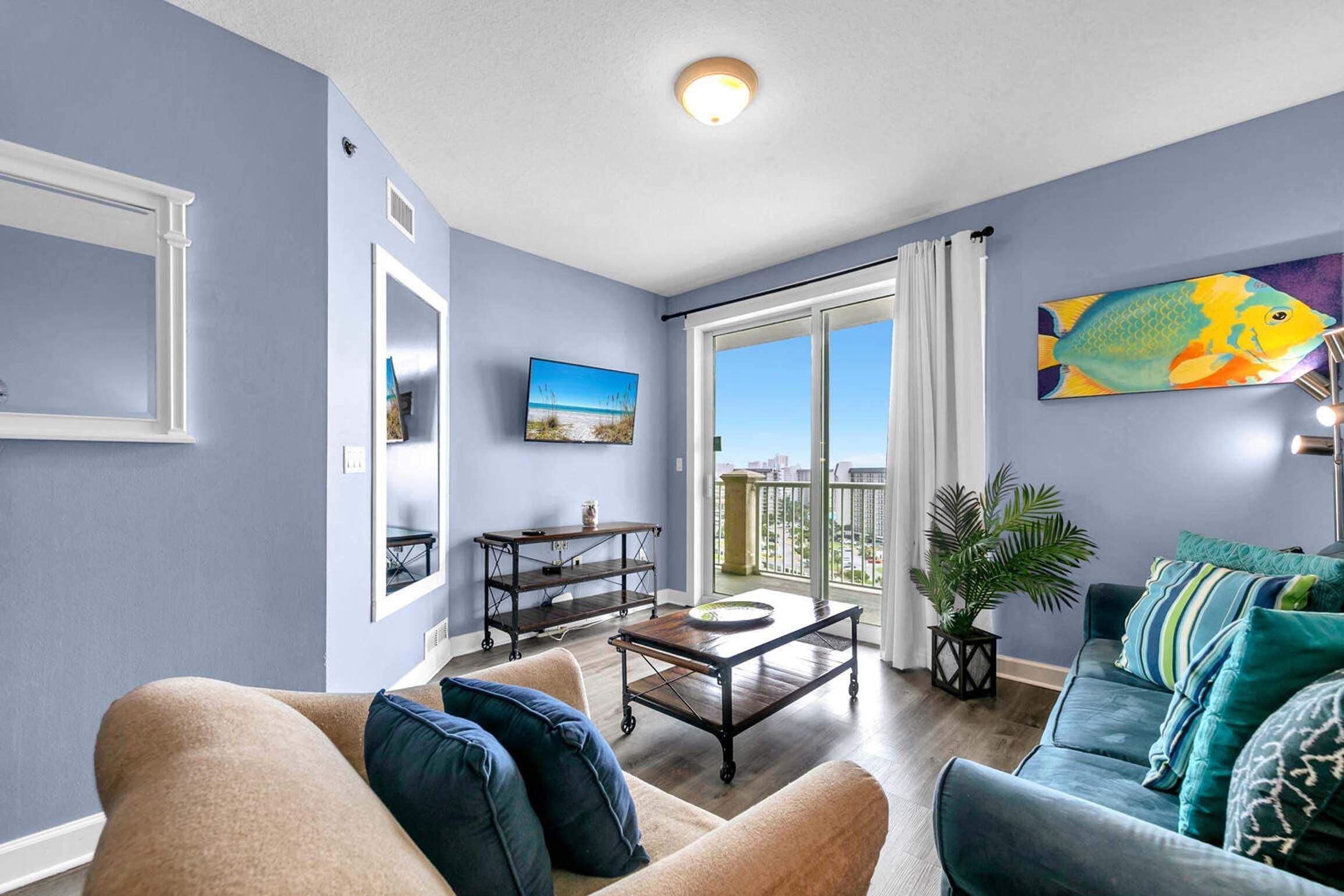 A living room with a sofa, coffee table, and a painting of a fish.