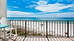 A balcony with a view of a beach and ocean. - Edgewater Tower 3-412 (Panama City Beach)