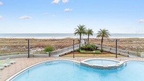 A swimming pool with a view of the beach and palm trees. - Spanish Key 603 (Pensacola)