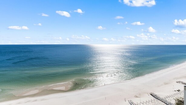A beach with clear skies and calm waters. - Palacio 1803 (Pensacola)
