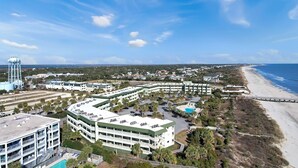 A coastal hotel with multiple buildings, a beach, and a pier. - 1 BR Top Floor Isle of Palms Oceanfront Condo | Pool | Free Wifi & Parking (Isle of Palms)
