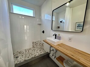 Shower, hair dryer, towels, soap