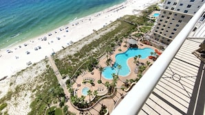 A resort with a beach, multiple pools, and a high-rise building. - Indigo East 1602 (Pensacola)