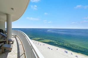 A balcony with a view of a beach and the ocean. - La Playa 1202 (Pensacola)