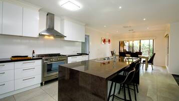 Coffee/tea maker, fridge, microwave, oven